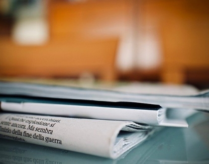 Newspapers laying on table