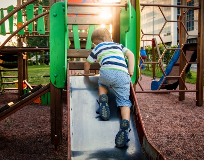 Boy on playground equipment
