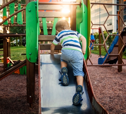 Boy on playground equipment